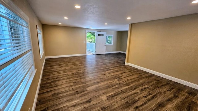 empty room featuring dark wood-type flooring