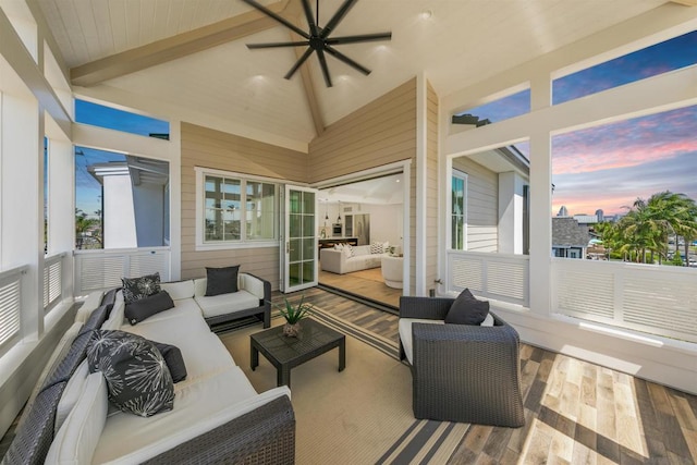 sunroom / solarium with lofted ceiling with beams