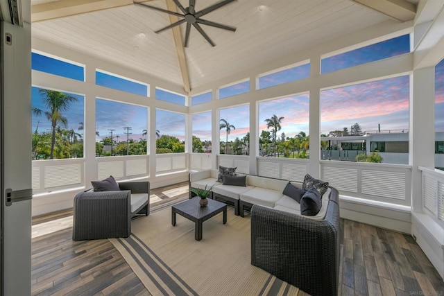 sunroom / solarium with ceiling fan and lofted ceiling with beams