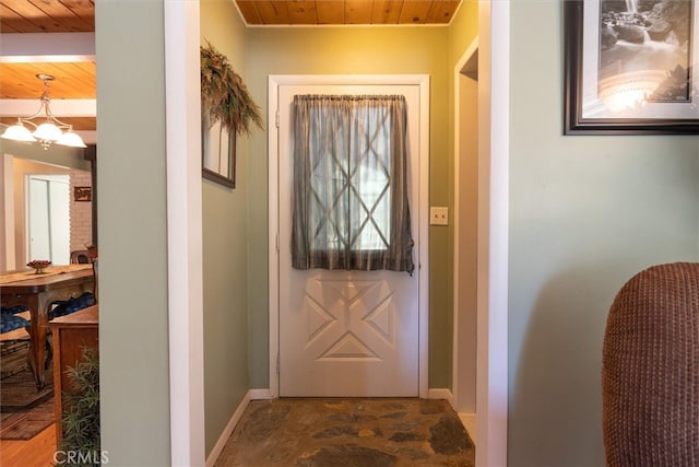 doorway to outside featuring wood ceiling