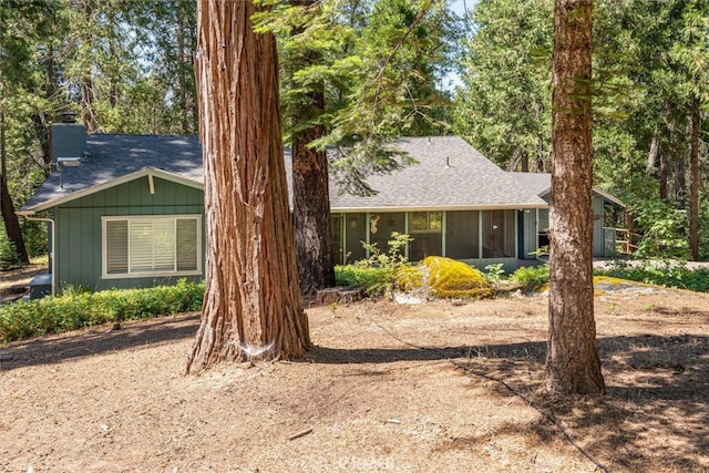 view of front facade with a sunroom