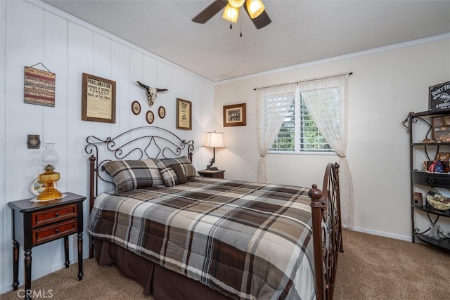 carpeted bedroom with crown molding and ceiling fan