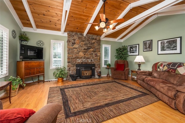 living room featuring vaulted ceiling with beams, hardwood / wood-style floors, and plenty of natural light