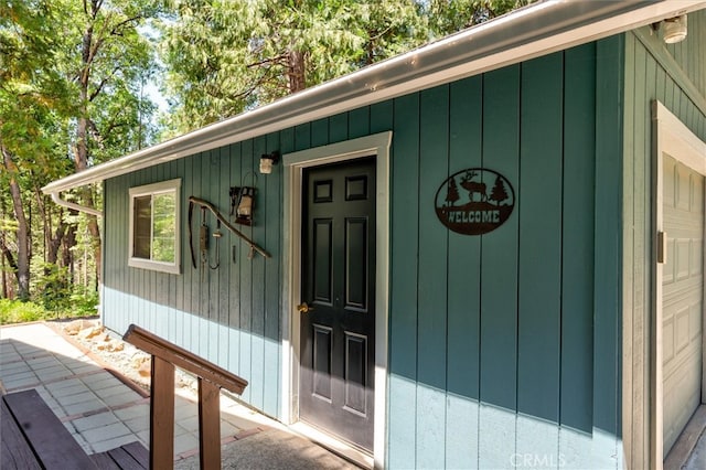 entrance to property featuring a garage