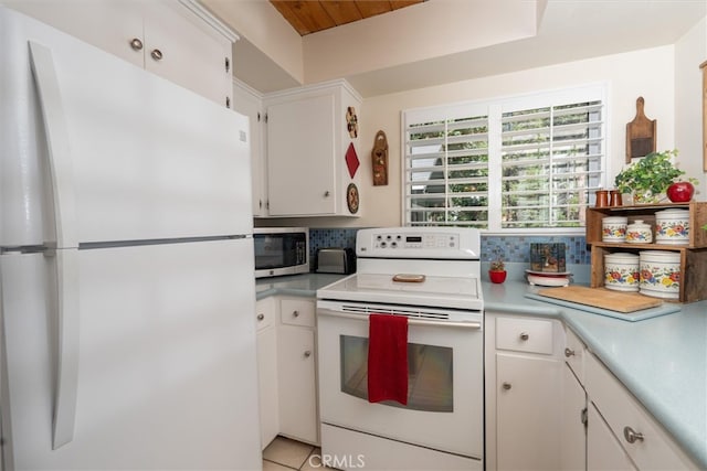 kitchen featuring white cabinetry, tasteful backsplash, wooden ceiling, and white appliances