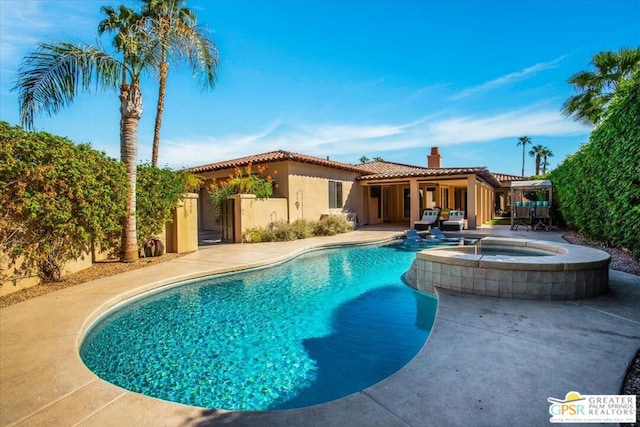 view of pool featuring an in ground hot tub and a patio