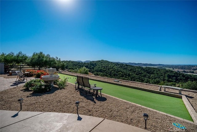 view of home's community with a patio area and a mountain view