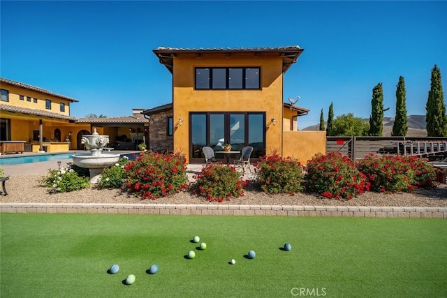 rear view of property with a patio area