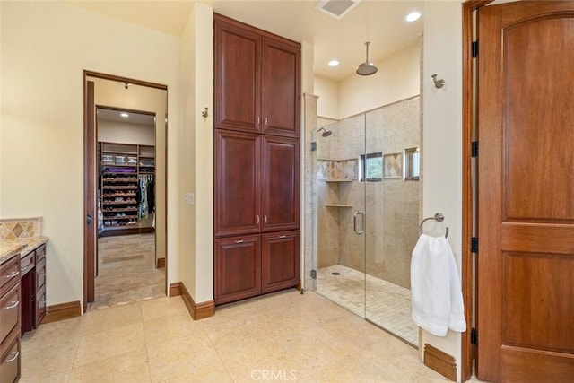 bathroom featuring vanity and walk in shower