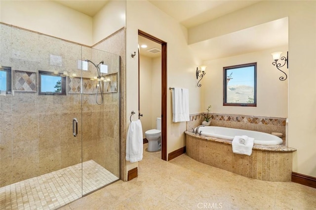 bathroom featuring toilet, tile patterned flooring, and independent shower and bath