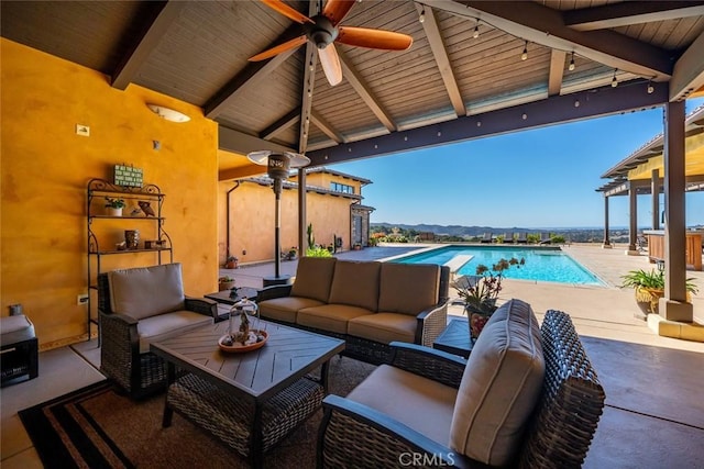 view of patio featuring ceiling fan and an outdoor living space