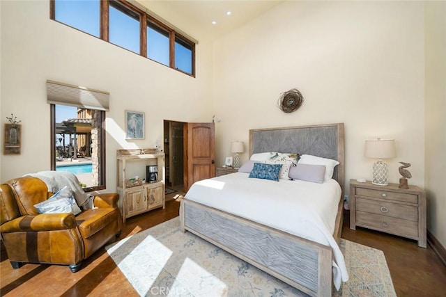 bedroom featuring a towering ceiling