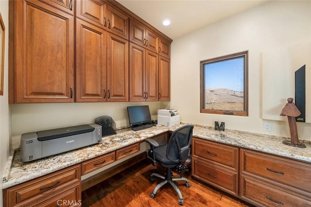 office space featuring built in desk and dark hardwood / wood-style floors