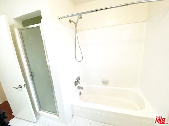 bathroom featuring tile patterned floors and separate shower and tub