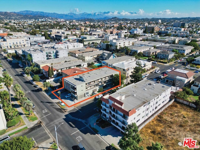 drone / aerial view featuring a mountain view