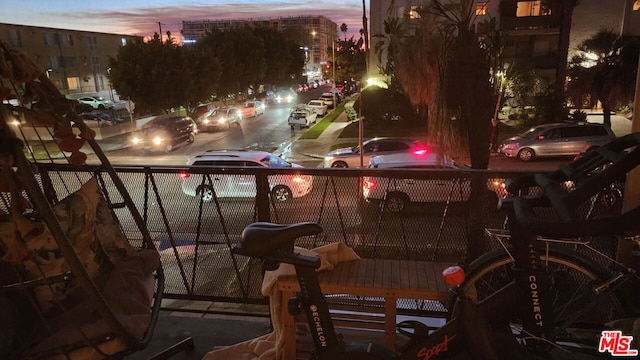 view of balcony at dusk