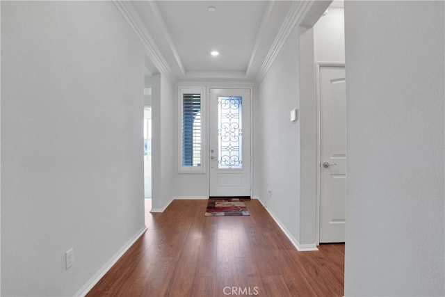 entryway featuring wood-type flooring and ornamental molding