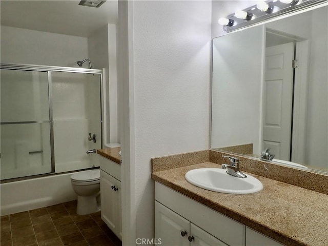 full bathroom featuring vanity, toilet, and enclosed tub / shower combo