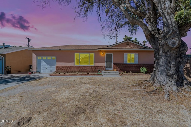 single story home featuring a garage