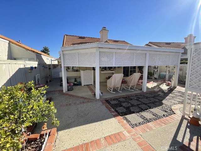 rear view of house featuring a patio area