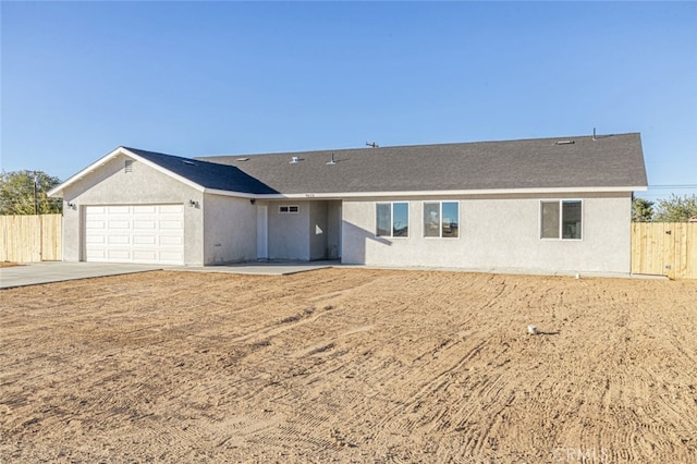 ranch-style home featuring a garage