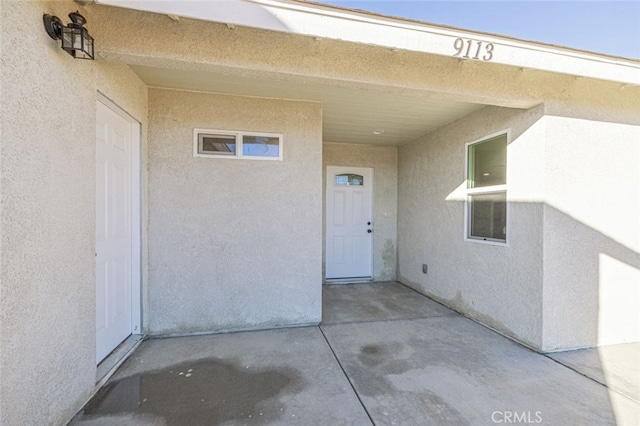 property entrance with a patio