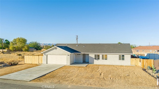 single story home with a garage