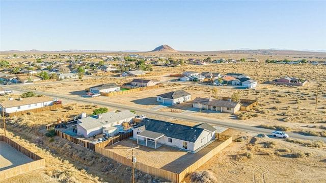 birds eye view of property featuring a mountain view