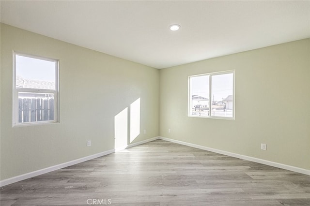 spare room featuring light wood-type flooring