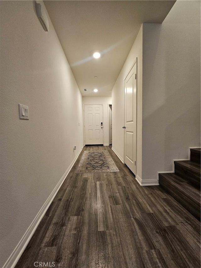 corridor with dark wood-type flooring