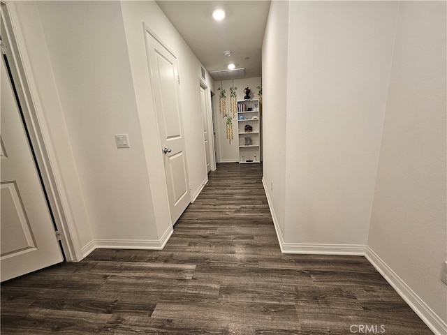 hall featuring dark wood-type flooring