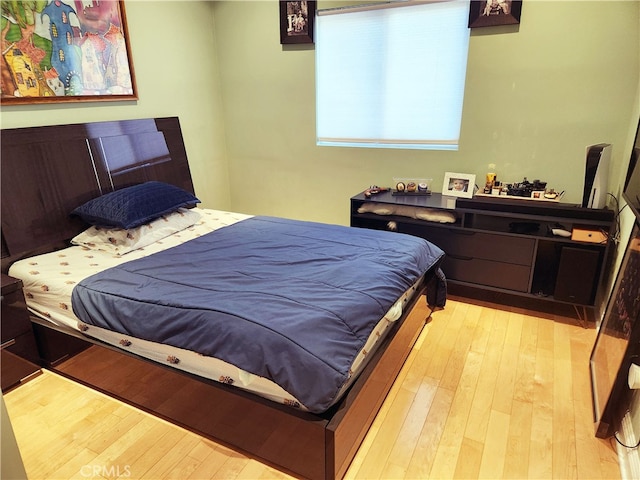 bedroom with light wood-type flooring