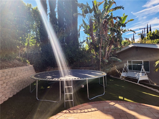 view of yard with a trampoline