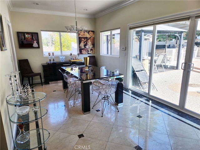 dining room with a notable chandelier, plenty of natural light, and crown molding