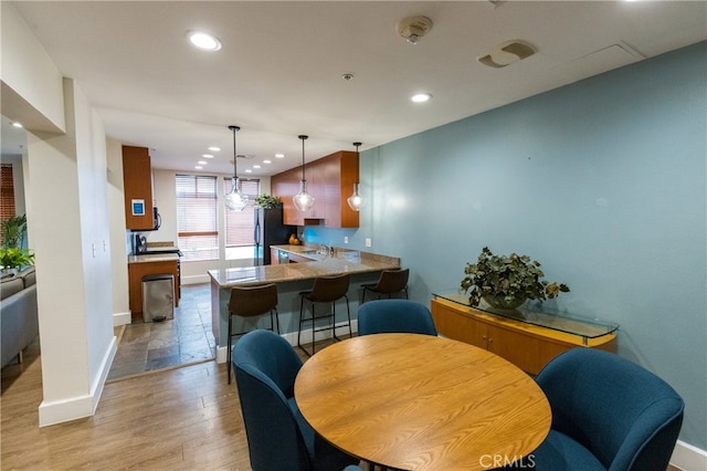 dining area with light wood-type flooring