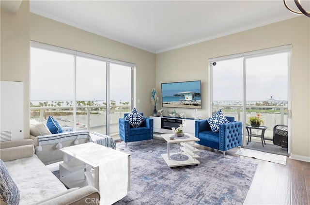 living room with hardwood / wood-style floors and crown molding