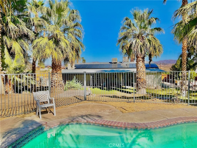 view of pool featuring a mountain view and a patio area