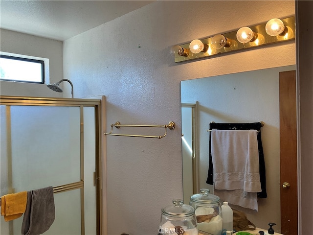 bathroom with a shower with door and toilet