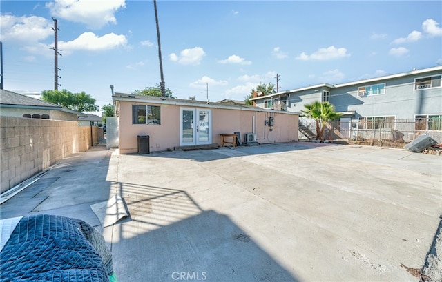 back of property with a patio