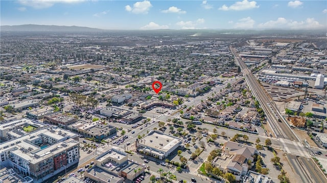 birds eye view of property featuring a mountain view