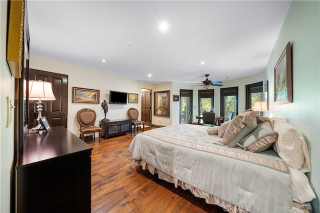 bedroom with ceiling fan and hardwood / wood-style floors