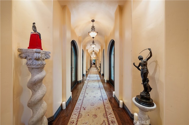 corridor featuring dark hardwood / wood-style floors