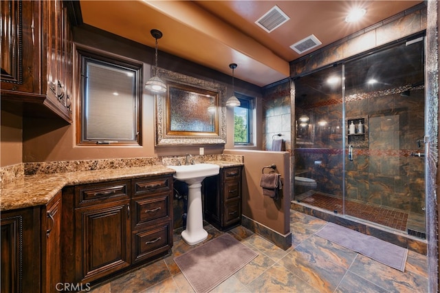 bathroom featuring walk in shower and sink