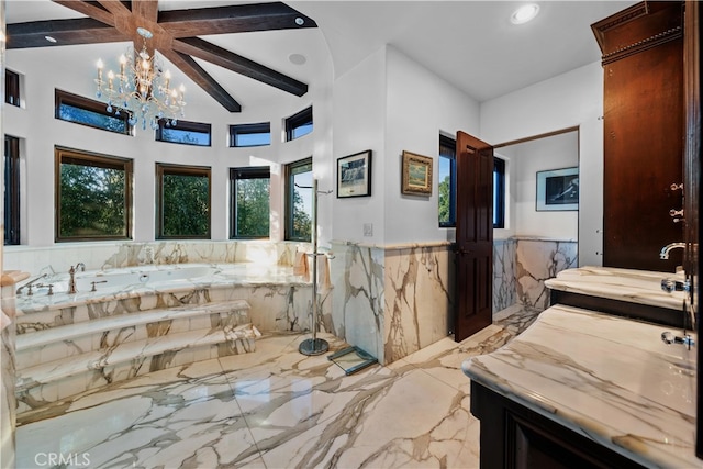 bathroom featuring a tub to relax in, vanity, beamed ceiling, and an inviting chandelier