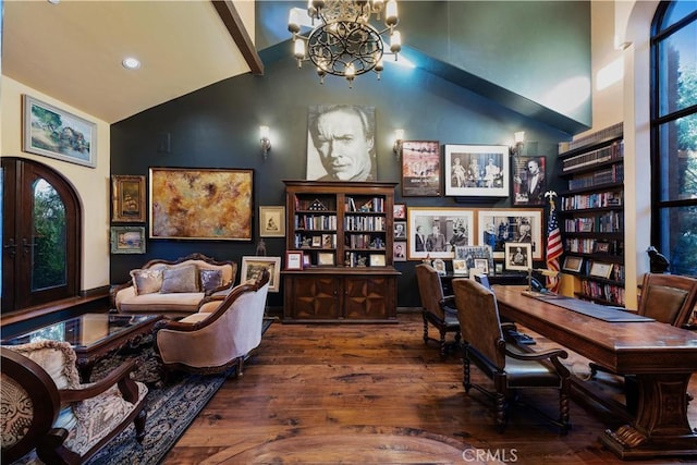 office featuring lofted ceiling, french doors, dark wood-type flooring, and a chandelier