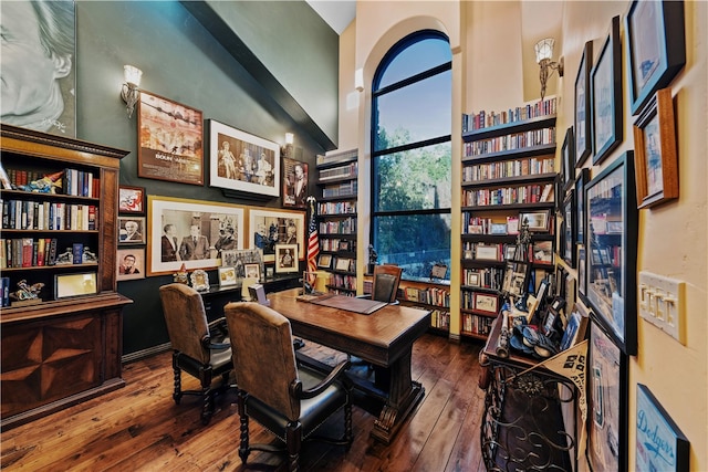 office space featuring dark wood-type flooring and lofted ceiling