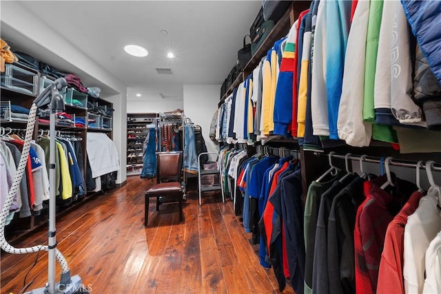 spacious closet with hardwood / wood-style floors