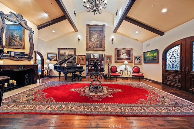 entryway with high vaulted ceiling, wood-type flooring, and beamed ceiling