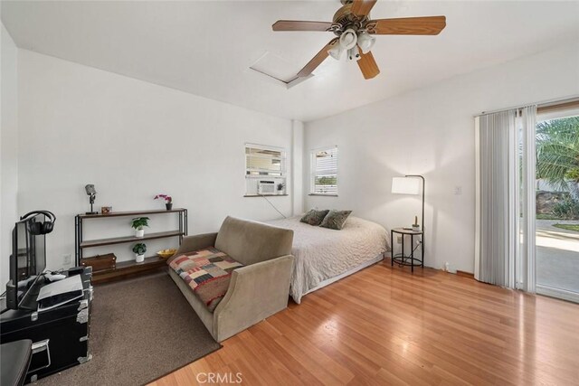 8865 San Gabriel Rd, Atascadero, CA 93422 - bedroom with access to exterior, wood finished floors, a ceiling fan, and cooling unit