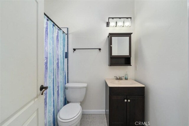 8865 San Gabriel Rd, Atascadero, CA 93422 - bathroom with vanity, toilet, tile patterned floors, and baseboards
